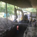 Challenging Locations - Septic tank site located below a deck.