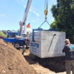 Concrete septic tank being placed