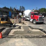 Fire Hydrant Service - Trenching being backfilled with cement slurry to avoid settling in roadway.