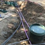 MicroSeptec Installation - Example of some of the tank plumbing prior to gravel bedding being placed.