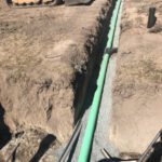 400' long sewer lateral to treatment tank